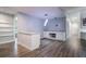 Dining area with granite countertop, white cabinets and shelves leading to the entrance at 352 Inglenook Cir, Winter Springs, FL 32708