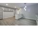 Open dining area with built in shelves and a pendant light fixture above the peninsula at 352 Inglenook Cir, Winter Springs, FL 32708