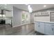Dining area with built-ins and pendant lighting near the kitchen and backyard access at 352 Inglenook Cir, Winter Springs, FL 32708