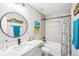 Well-lit bathroom with a tub-shower combination and stylish mirror at 38 Malauka Dr, Ocklawaha, FL 32179
