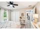 Comfortable bedroom featuring a ceiling fan and natural light at 38 Malauka Dr, Ocklawaha, FL 32179