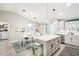 Open concept kitchen with quartz counters, stainless appliances, and modern lighting at 38 Malauka Dr, Ocklawaha, FL 32179