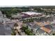 Aerial view of a neighborhood near shops, restaurants, townhomes, and palm-tree-lined streets at 415 Old Farm Ln, Winter Springs, FL 32708