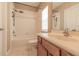 Well-lit bathroom featuring a tub-shower combo, vanity, and white tile flooring at 415 Old Farm Ln, Winter Springs, FL 32708
