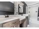 Bathroom featuring dual sinks, modern tile accents, and combination shower/tub at 415 Old Farm Ln, Winter Springs, FL 32708