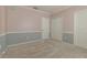 This roomy bedroom boasts neutral colored walls, carpet, and trim and a large closet with double doors at 415 Old Farm Ln, Winter Springs, FL 32708