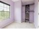 Bedroom with custom built-in shelving, offering ample storage and a cozy atmosphere at 415 Old Farm Ln, Winter Springs, FL 32708