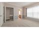 Spacious bedroom featuring neutral carpet, large window and walk-in closet with built-in shelving for maximum storage at 415 Old Farm Ln, Winter Springs, FL 32708