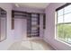 Walk-in closet features custom built-in shelving, providing ample storage space and organization at 415 Old Farm Ln, Winter Springs, FL 32708