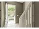 Bright entryway featuring a view of the front yard, light tile floors, and a staircase at 415 Old Farm Ln, Winter Springs, FL 32708