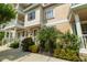 Charming townhome featuring classic architecture, a neatly landscaped yard, and welcoming curb appeal at 415 Old Farm Ln, Winter Springs, FL 32708