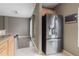 Gourmet kitchen featuring stainless steel appliances, granite countertops, and an oversized refrigerator at 415 Old Farm Ln, Winter Springs, FL 32708