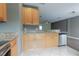 Kitchen featuring stainless steel appliances, granite countertops, a double sink, and ample cabinet space at 415 Old Farm Ln, Winter Springs, FL 32708