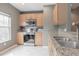This spacious kitchen has stainless steel appliances, lots of natural light and gorgeous granite countertops at 415 Old Farm Ln, Winter Springs, FL 32708