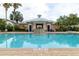 Serene community pool with a cascading water feature and inviting lounge area at 415 Old Farm Ln, Winter Springs, FL 32708