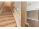 Staircase features neutral carpet, white banisters, and access to wood floors at 415 Old Farm Ln, Winter Springs, FL 32708