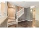 Bright entry featuring wood floors, carpeted stairs, and a modern color palette at 415 Old Farm Ln, Winter Springs, FL 32708