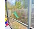 Fenced backyard featuring a playground with slide and an in-ground garden at 4235 Shades Crest Ln, Sanford, FL 32773
