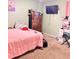 Cozy bedroom features carpet floors, a TV, and a writing desk with a stool at 4235 Shades Crest Ln, Sanford, FL 32773
