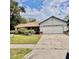 Charming single-Gathering home with attached two-car garage and well-maintained lawn at 4235 Shades Crest Ln, Sanford, FL 32773