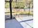 Screened in patio with paved flooring featuring a fire pit and access to backyard at 4235 Shades Crest Ln, Sanford, FL 32773
