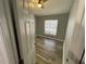 Bedroom with wood look flooring, ceiling fan, and natural light from window at 4503 Oak Arbor Cir, Orlando, FL 32808