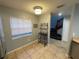Bright dining area with a window and view into the staircase at 4503 Oak Arbor Cir, Orlando, FL 32808
