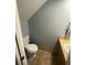 Cozy half bathroom with a toilet, sink, and a clean, neutral color palette at 4503 Oak Arbor Cir, Orlando, FL 32808