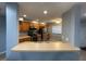 Kitchen features stainless steel appliances, oak cabinets, and a pass-through bar to the living room at 4503 Oak Arbor Cir, Orlando, FL 32808