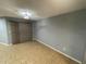 Neutral living room space offering a blank canvas and sliding glass door at 4503 Oak Arbor Cir, Orlando, FL 32808