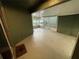 Spacious enclosed patio with painted concrete floor, exterior doors, and screen windows at 4503 Oak Arbor Cir, Orlando, FL 32808