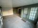 Covered patio with painted concrete floor, exterior doors, and screen windows at 4503 Oak Arbor Cir, Orlando, FL 32808