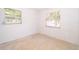 Bedroom featuring two windows at 4524 King Cole Blvd, Orlando, FL 32811
