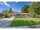 Charming single-story home with a well-maintained lawn and inviting front entrance at 4524 King Cole Blvd, Orlando, FL 32811