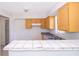 Bright kitchen features yellow cabinets and a window over the sink at 4524 King Cole Blvd, Orlando, FL 32811