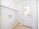 Clean laundry room features tile floor and back door at 4524 King Cole Blvd, Orlando, FL 32811