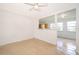 Cozy living space with terrazzo flooring, seamlessly connected to the dining area and kitchen at 4524 King Cole Blvd, Orlando, FL 32811