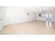Bright and airy living room with terrazzo flooring, providing a clean and spacious ambiance at 4524 King Cole Blvd, Orlando, FL 32811