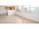 Cozy living space with terrazzo flooring, seamlessly connected to the dining area and kitchen at 4524 King Cole Blvd, Orlando, FL 32811
