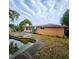 View of the backyard, house exterior, and inground swimming pool at 4840 Judy Ann Ct, Orlando, FL 32808
