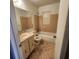 Bathroom with tile flooring, standard bathtub, toilet, and vanity with mirror at 4840 Judy Ann Ct, Orlando, FL 32808