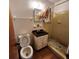 Modest bathroom with toilet, vanity, mirror, and small tiled shower stall at 4840 Judy Ann Ct, Orlando, FL 32808