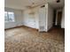 Bedroom interior with one window, a door, brown carpet and water damage on the walls at 4840 Judy Ann Ct, Orlando, FL 32808