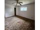 Bedroom featuring carpet floors, a ceiling fan, and a bright window for natural light at 4840 Judy Ann Ct, Orlando, FL 32808