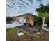 View of the side of the home featuring an attached two-car garage at 4840 Judy Ann Ct, Orlando, FL 32808
