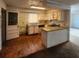 Kitchen featuring cabinetry and a view into the living area at 4840 Judy Ann Ct, Orlando, FL 32808