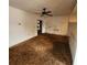 Living room with a ceiling fan and view into the kitchen at 4840 Judy Ann Ct, Orlando, FL 32808