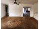 Living room with a ceiling fan and view to adjacent rooms at 4840 Judy Ann Ct, Orlando, FL 32808