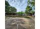 Backyard pool featuring a concrete deck, trees, and a partial fence at 4840 Judy Ann Ct, Orlando, FL 32808