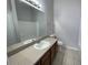 Bathroom with vanity, large mirror, and shower and tub combo at 514 Wilton Cir, Sanford, FL 32773